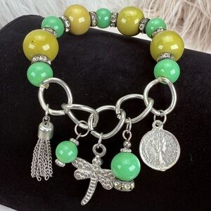 Silvertone and green Small costume stretch charm bracelet